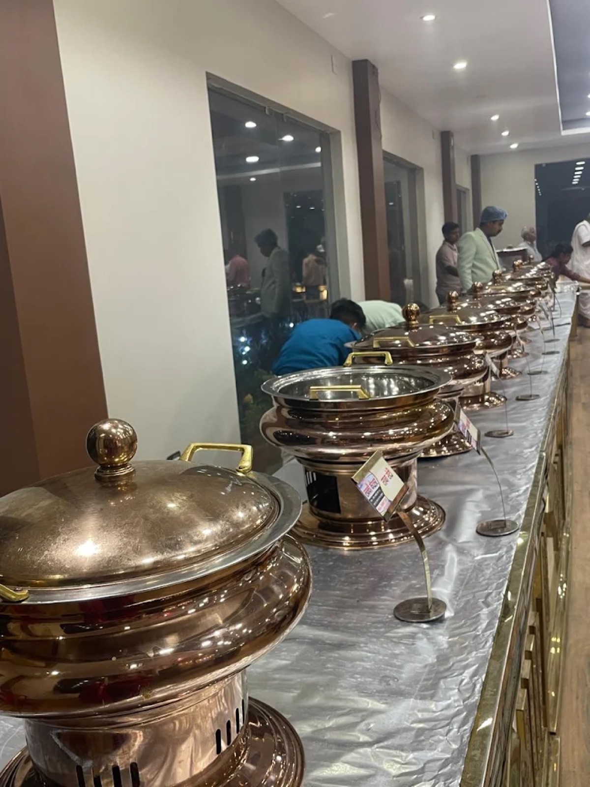 In-house catering with a long buffet line of chafing dishes at Shri Nath Palace, Deoghar
