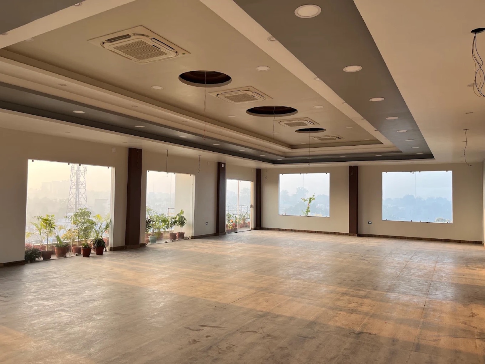 Large air-conditioned rooftop banquet hall with city views at Shri Nath Palace, Deoghar