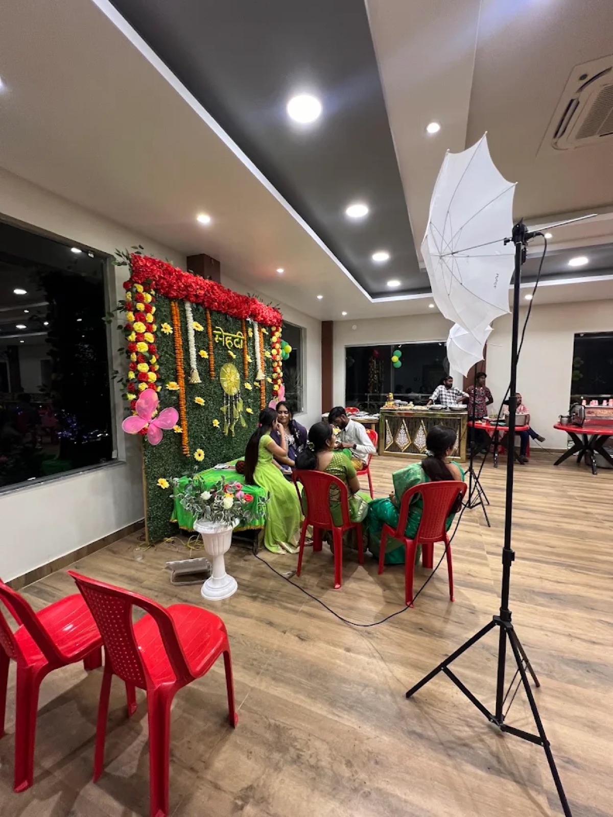 Green mehndi ceremony stage decoration at Shri Nath Palace, Deoghar