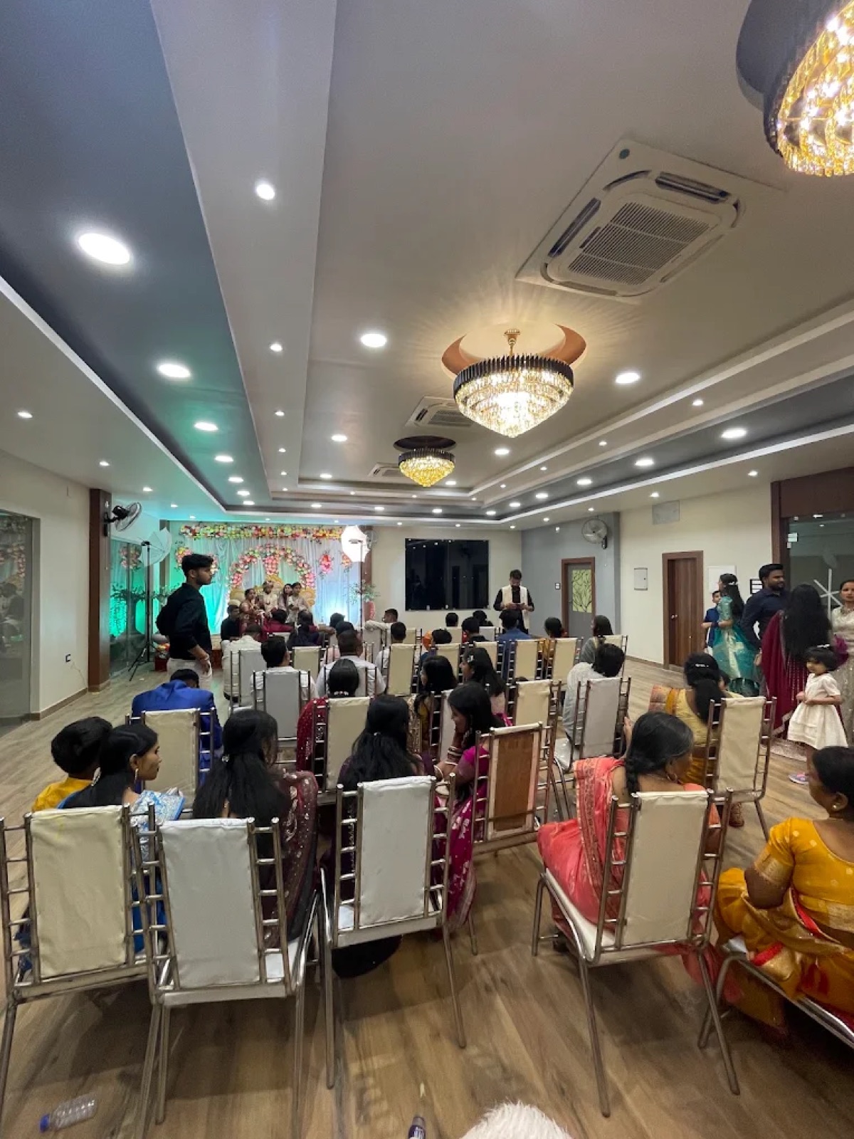 Guests seated for a family function at Shri Nath Palace banquet hall, Deoghar