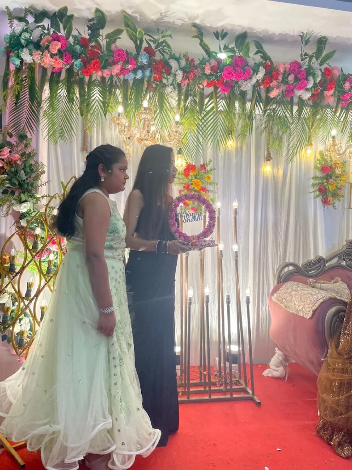 Reception ceremony with aarti at a floral stage in Shri Nath Palace, Deoghar