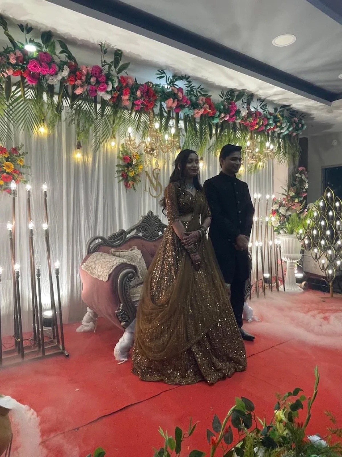 Wedding reception with floral stage decor at Shri Nath Palace, Deoghar
