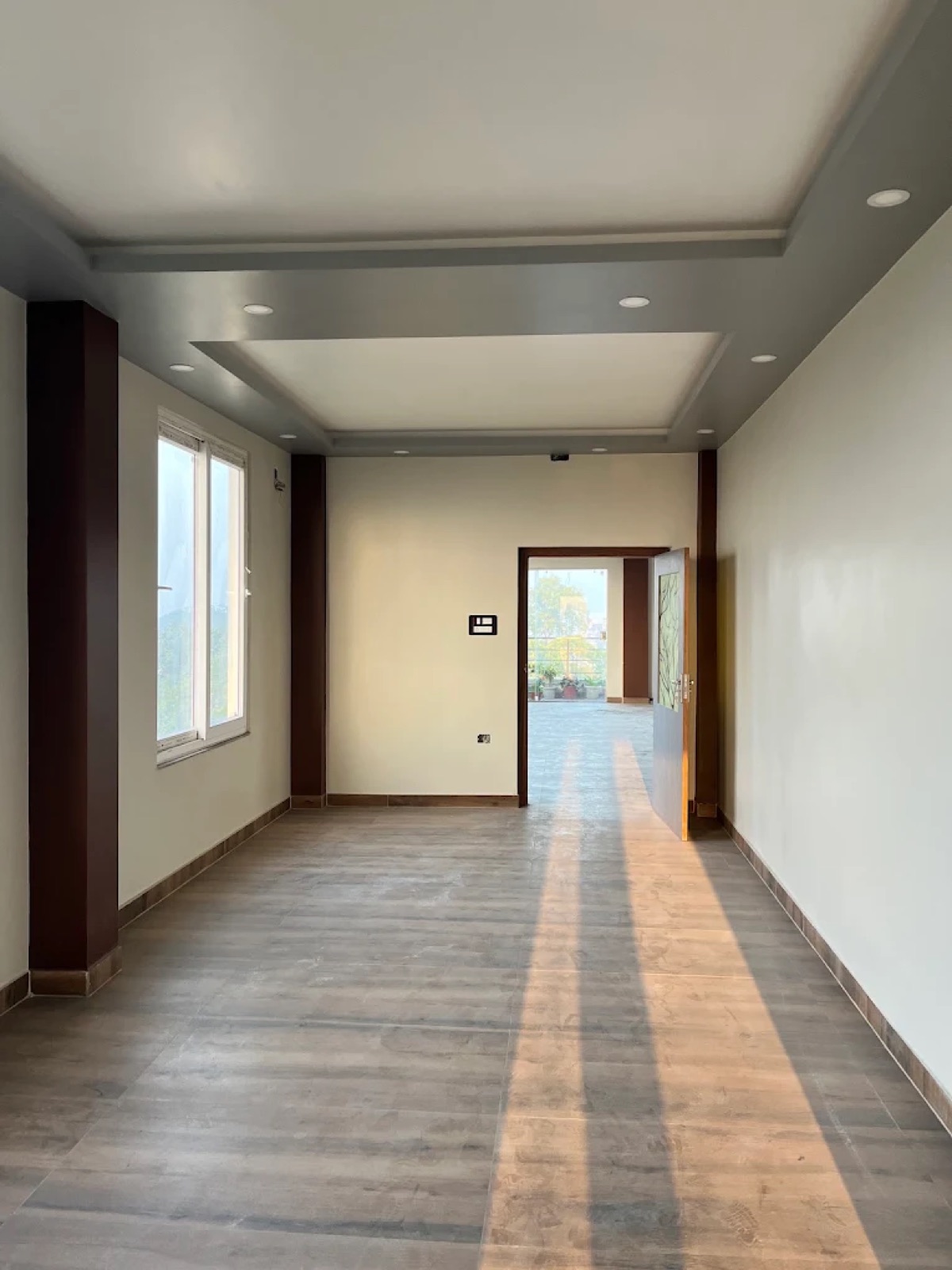 Bright open common hall with terrace access at Shri Nath Palace, Deoghar